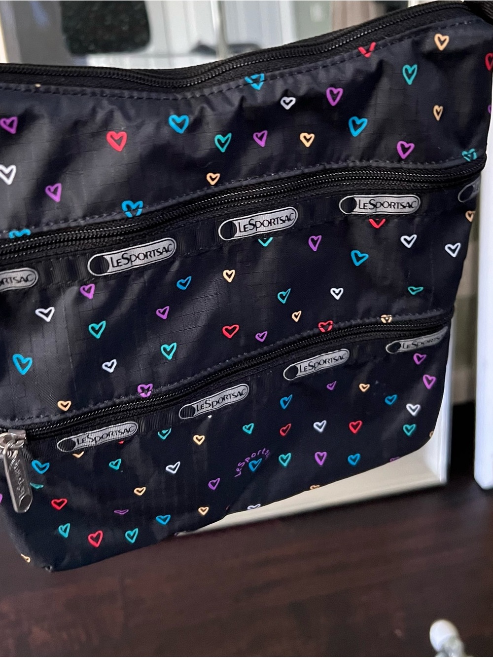 Lesportsac Black Crossbody Bag with Multicolor Heart Print